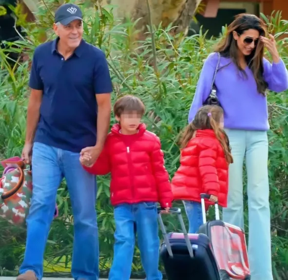 Amal Clooney and George Clooney with twins Alexander and Ella in a cozy morning family moment at their English estate.